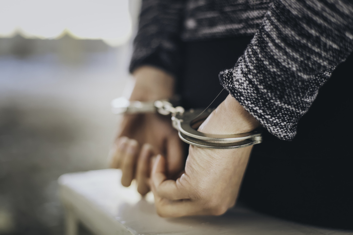person in handcuffs